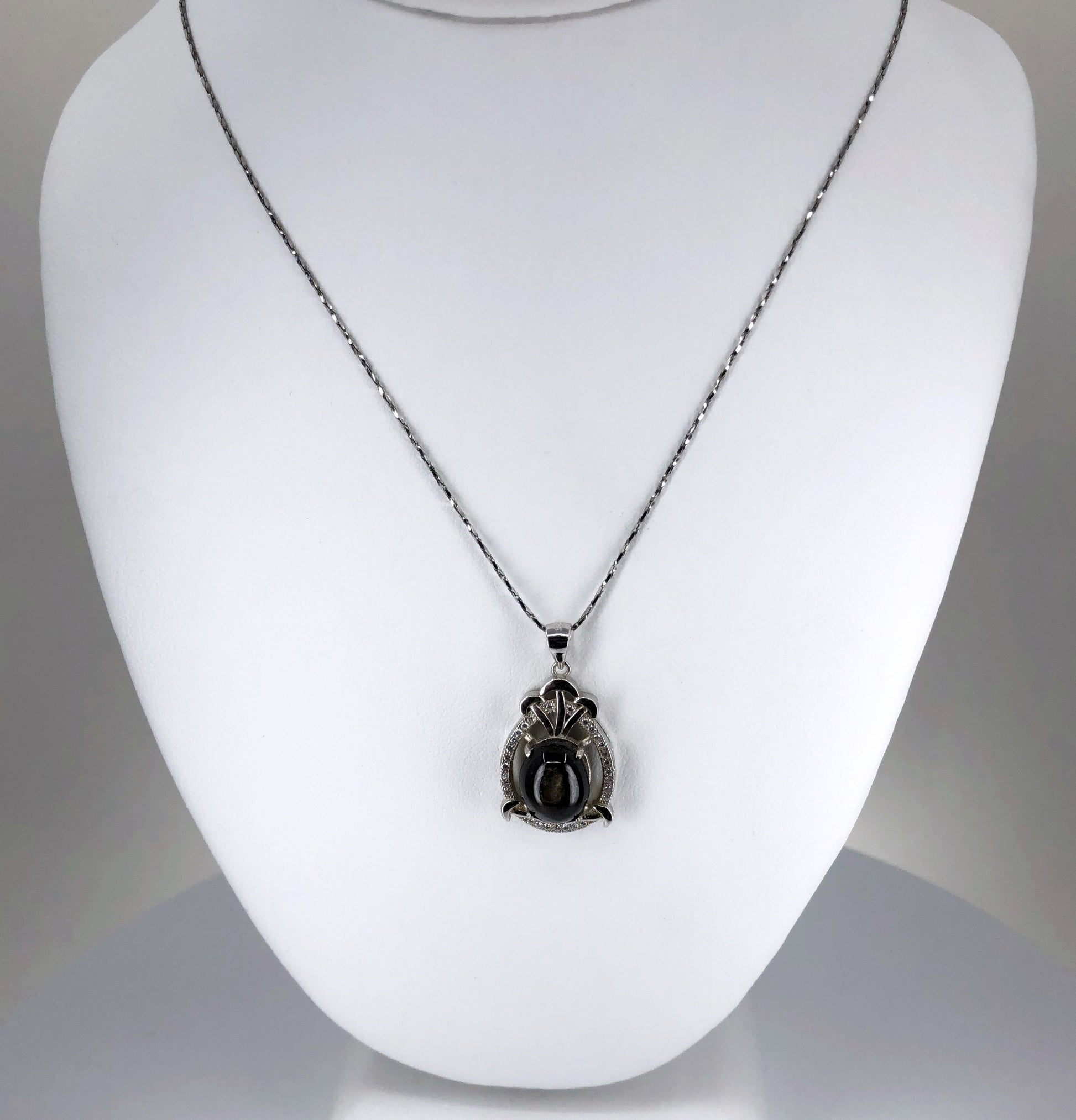 black star sapphire pendant necklace with a cubic zirconia halo with a 20" chain