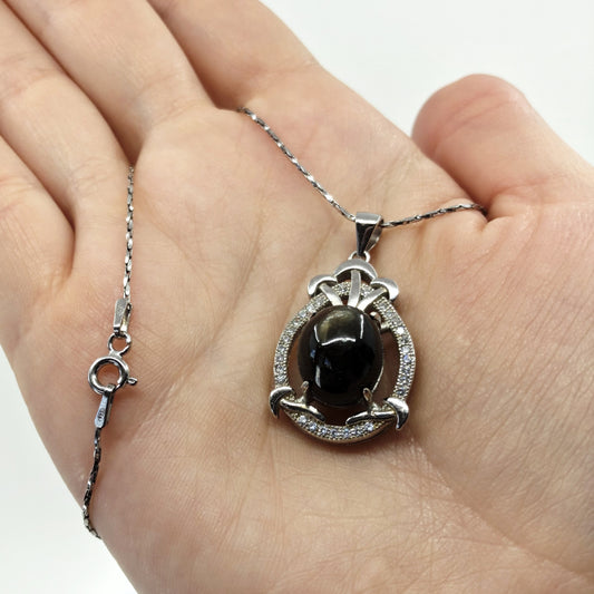 black star sapphire pendant necklace with a cubic zirconia halo with a 20" chain